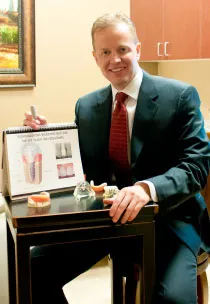 Dr. Hammond with models of dentures