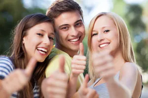 Teens giving a thumbs up