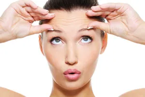 woman lifting forehead