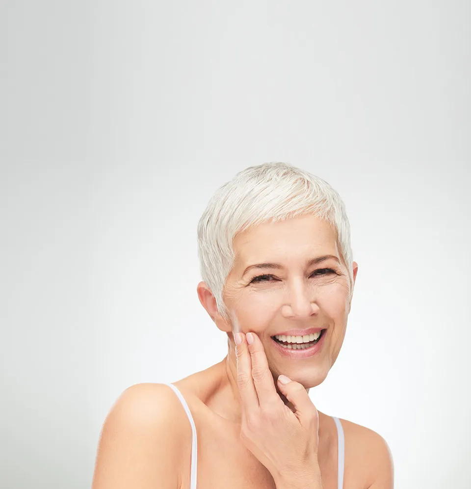 smiling woman touching her jaw